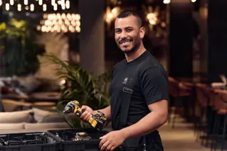 Property manager with drill in hand